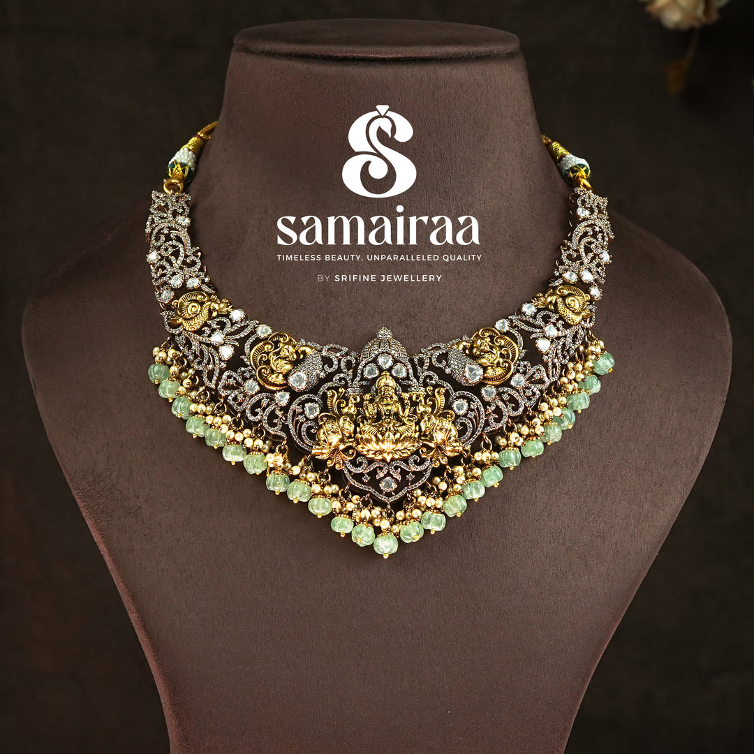 Traditional Samairaa antique temple necklace in 92.5 silver with Lakshmi motif, victorian detailing, green bead drops and cz stones | premium traditional bridal jewellery by Sri Fine Jewellery, Hyderabad

