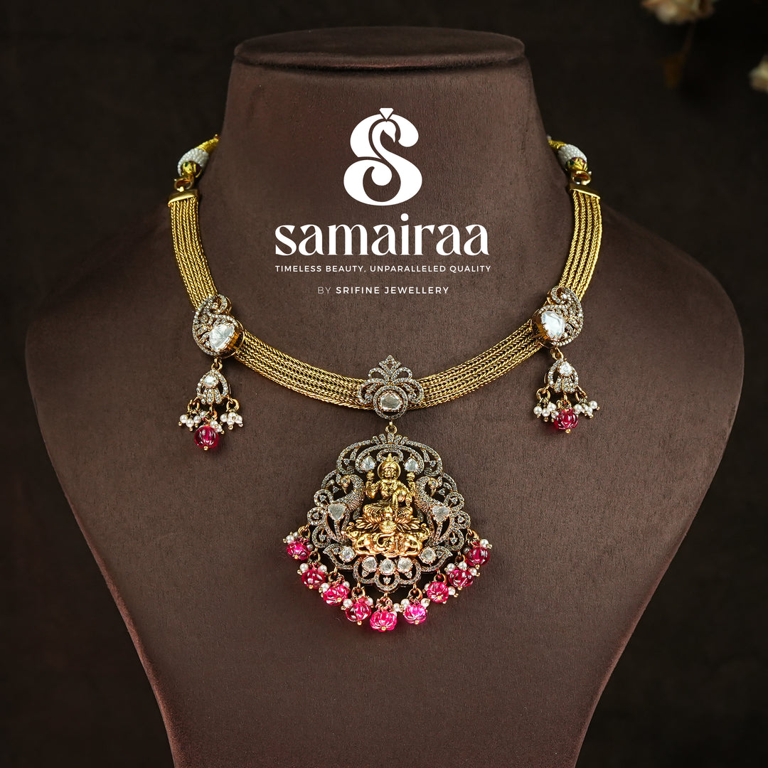 Traditional Samairaa temple pendant necklace in 92.5 silver with goddess Lakshmi motif, antique gold finish, pink stone drops and cz detailing | traditional bridal temple jewellery by Sri Fine Jewellery, Hyderabad 
