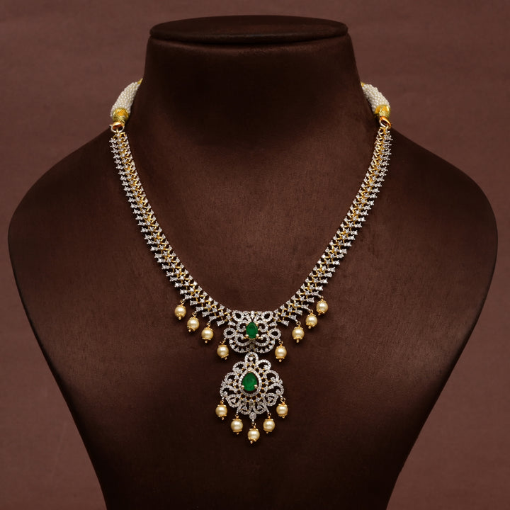 Luxury diamond-look silver cz emerald necklace with premium cz stones, semi-precious emerald stone and  pearl drops in 92.5 silver, bridal wedding jewellery with gold finish by Sri Fine Jewellery Punjagutta Hyderabad.