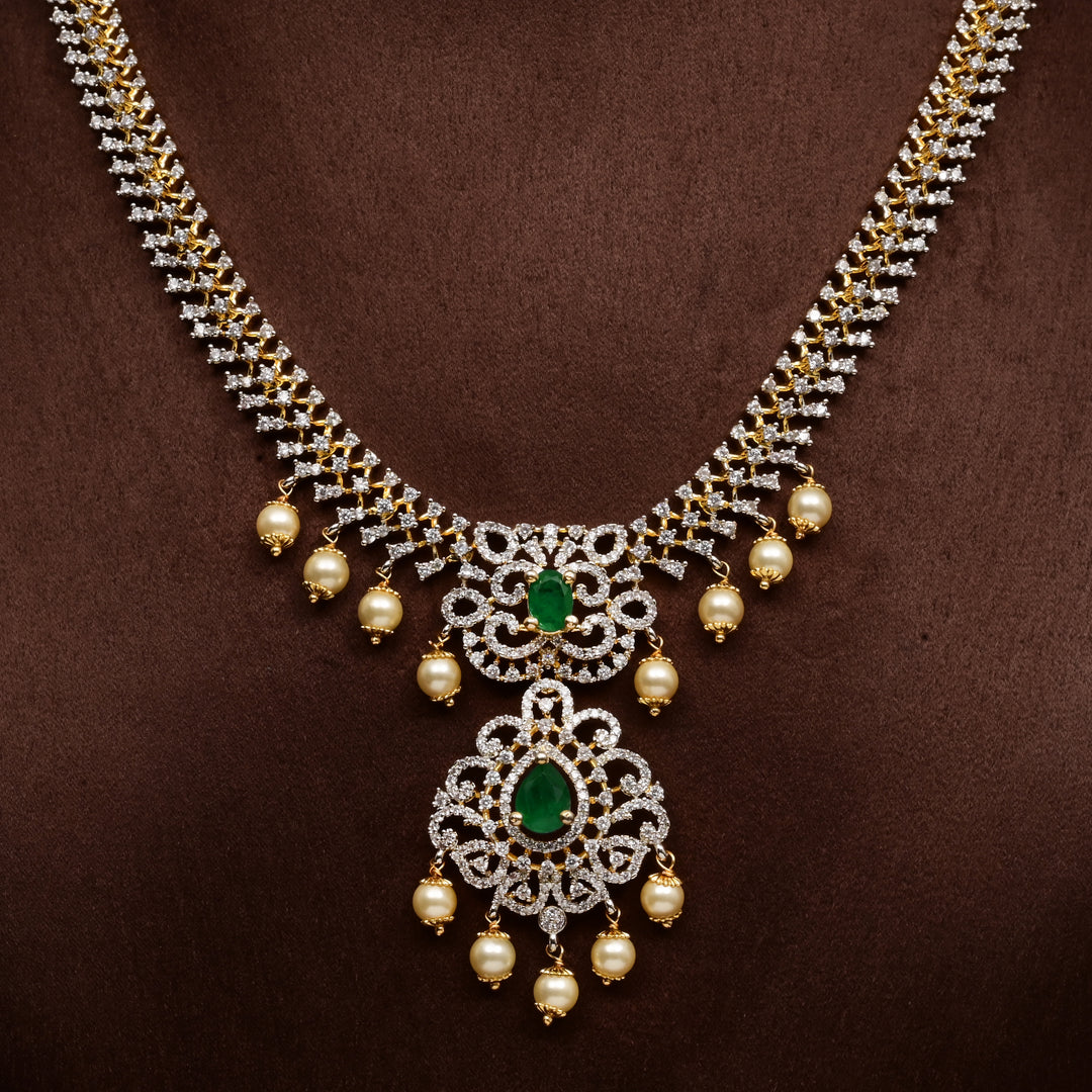 Luxury diamond-look silver cz emerald necklace with premium cz stones, semi-precious emerald stone and  pearl drops in 92.5 silver, bridal wedding jewellery with gold finish by Sri Fine Jewellery Punjagutta Hyderabad.