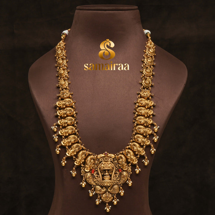 Traditional 92.5 silver temple necklace with peacock motifs, ruby stone detailing, and intricate heritage craftsmanship by Sri Fine Jewellery Hyderabad (https://srifinejewellery.com)