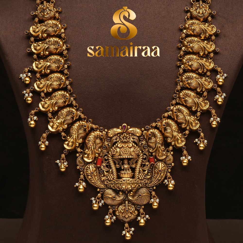 Traditional 92.5 silver temple necklace with peacock motifs, ruby stone detailing, and intricate heritage craftsmanship by Sri Fine Jewellery Hyderabad (https://srifinejewellery.com)