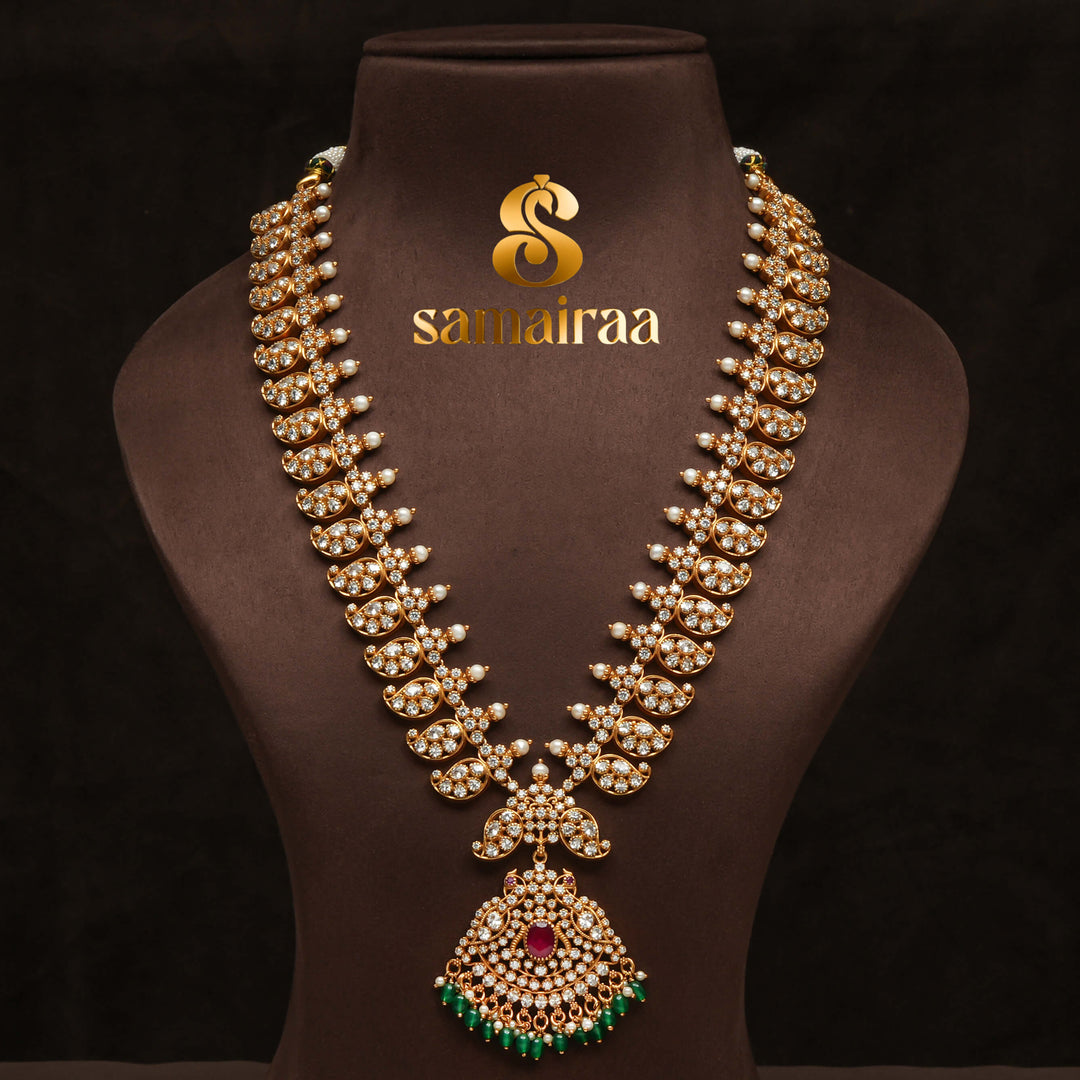 Traditional elegant cz 92.5 silver necklace with antique gold finish, sparkling stone detailing, ruby pendant and green bead drops for bridal and festive wear by Sri Fine Jewellery Hyderabad.
