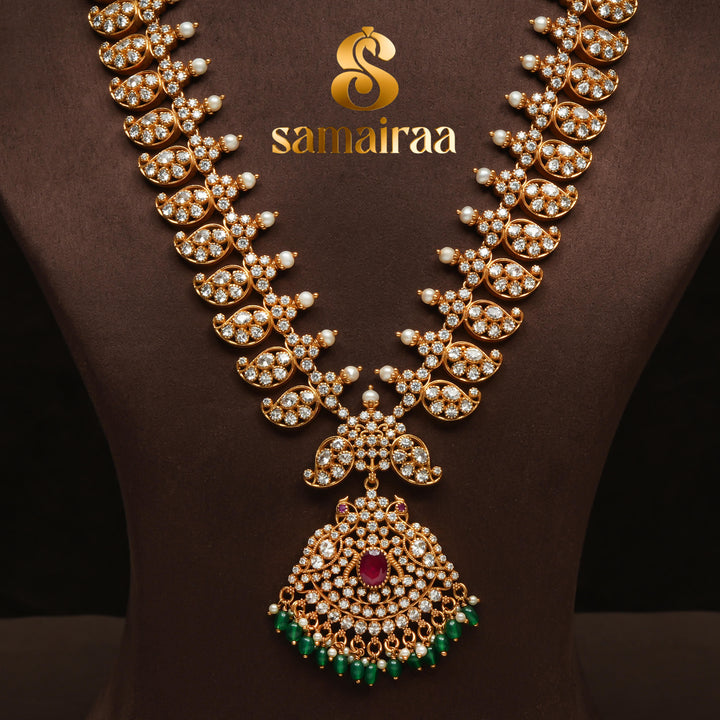 Traditional elegant cz 92.5 silver necklace with antique gold finish, sparkling stone detailing, ruby pendant and green bead drops for bridal and festive wear by Sri Fine Jewellery Hyderabad.
