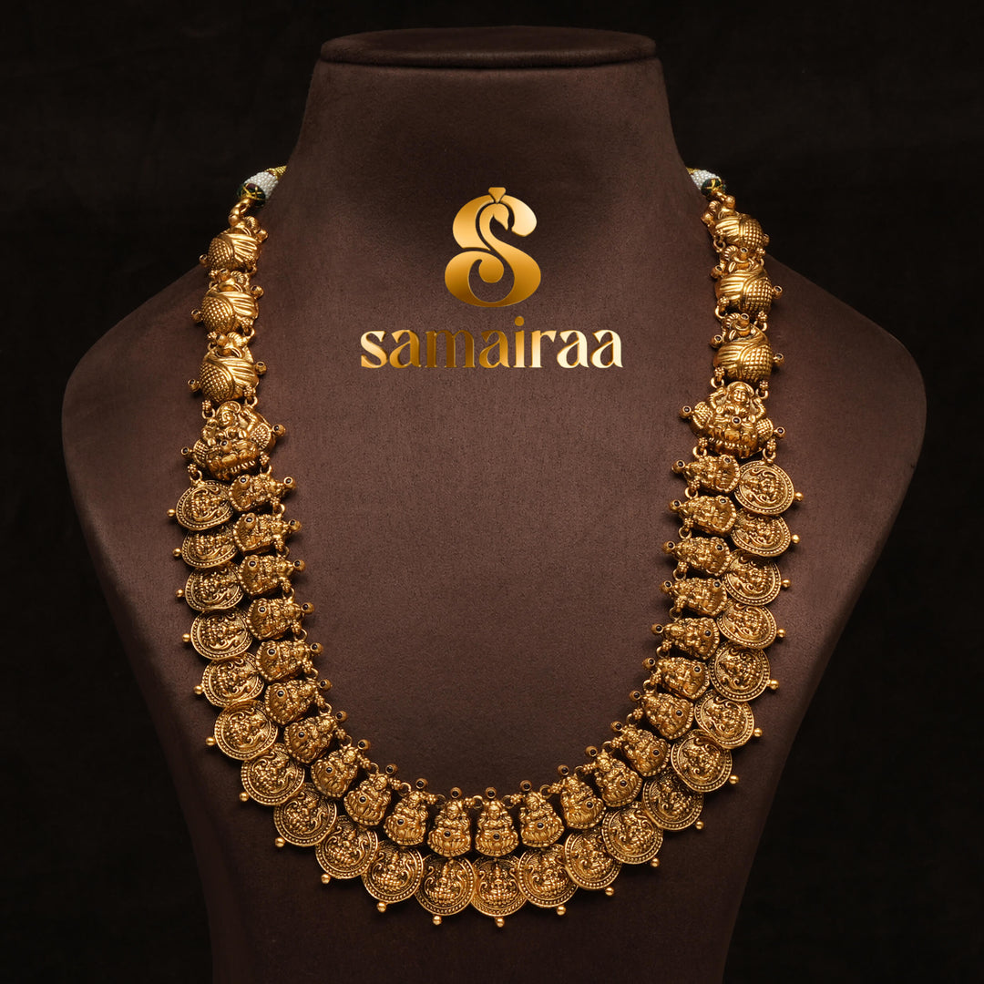 Traditional antique temple silver 92.5 necklace with floral kundan motifs, peacock design, green bead drops and traditional South Indian bridal jewellery craftsmanship by Sri Fine Jewellery Hyderabad.
