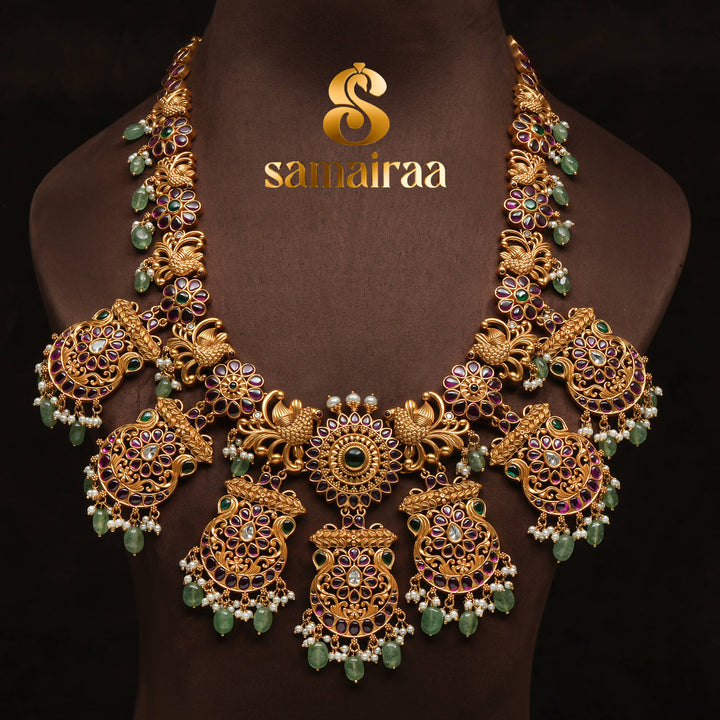 Traditional antique temple 92.5 silver necklace with floral kundan motifs, peacock design, green bead drops and traditional South Indian bridal jewellery craftsmanship by Sri Fine Jewellery Hyderabad.
