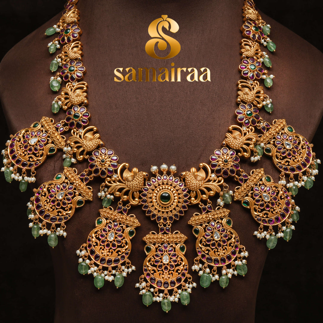 Traditional antique temple 92.5 silver necklace with floral kundan motifs, peacock design, green bead drops and traditional South Indian bridal jewellery craftsmanship by Sri Fine Jewellery Hyderabad.
