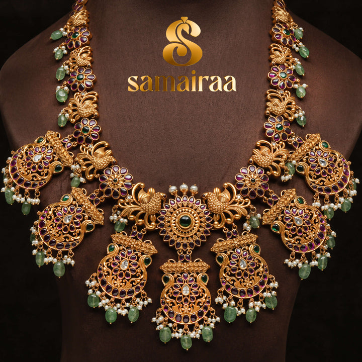 Traditional antique temple 92.5 silver necklace with floral kundan motifs, peacock design, green bead drops and traditional South Indian bridal jewellery craftsmanship by Sri Fine Jewellery Hyderabad.
