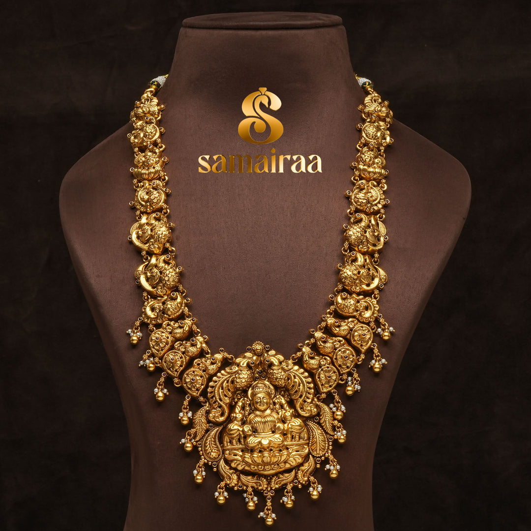 Traditional antique temple 92.5 silver necklace with peacock motifs, Lakshmi pendant, gold bead drops and traditional South Indian bridal jewellery design by Sri Fine Jewellery Hyderabad.