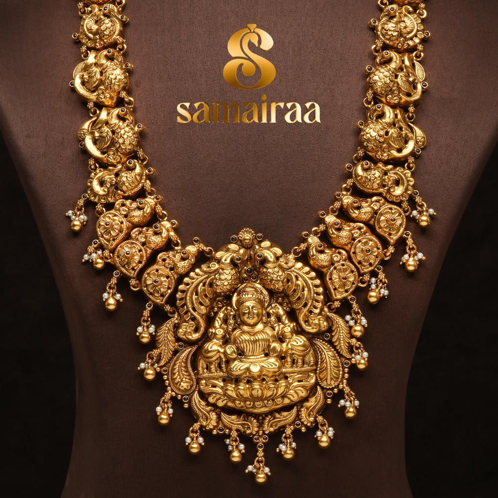 Traditional antique temple 92.5 silver necklace with peacock motifs, Lakshmi pendant, gold bead drops and traditional South Indian bridal jewellery design by Sri Fine Jewellery Hyderabad.