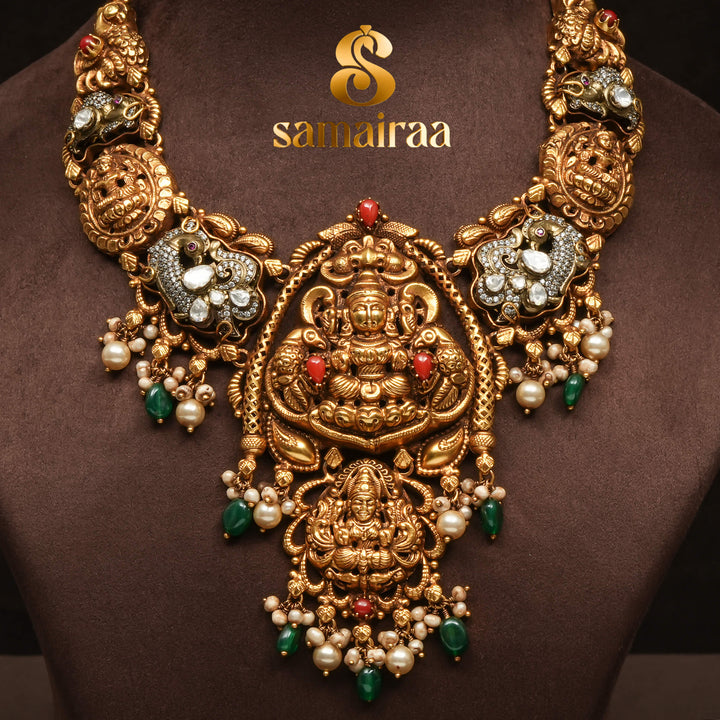 Traditional 92.5 silver temple necklace with Lakshmi pendant, ruby stone detailing, peacock motifs and intricate heritage craftsmanship by Sri Fine Jewellery Hyderabad (https://srifinejewellery.com)