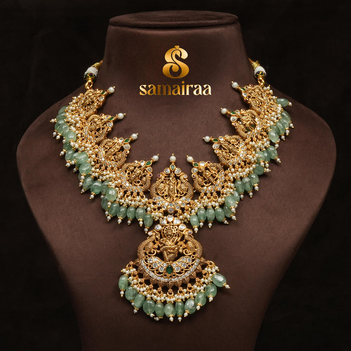 Traditional antique temple silver necklace with green jade beads, Lakshmi pendant, pearl detailing and traditional South Indian bridal jewellery design by Sri Fine Jewellery Hyderabad.
