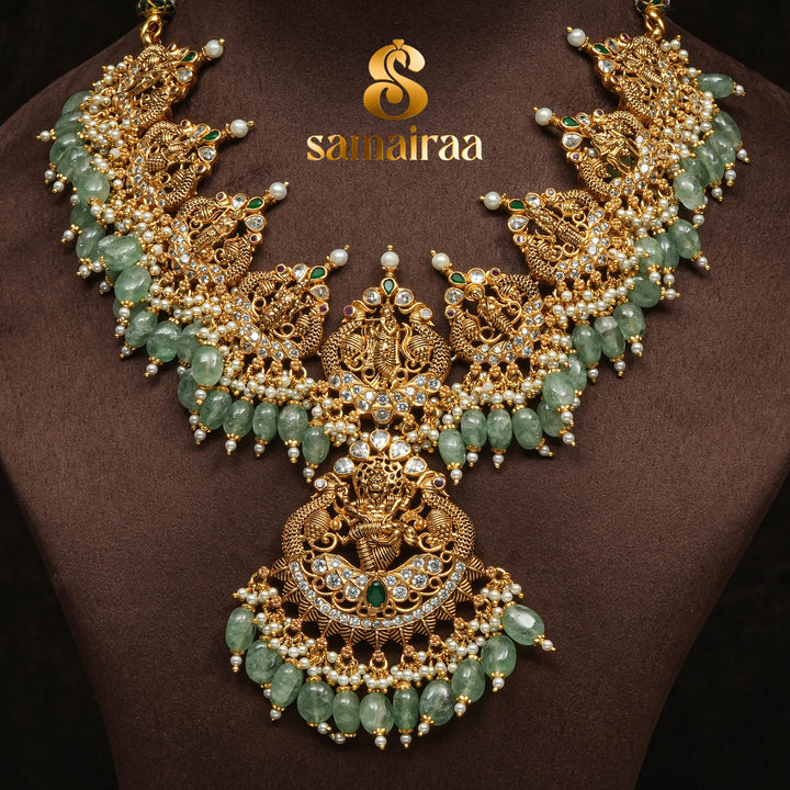 Traditional antique temple silver necklace with green jade beads, Lakshmi pendant, pearl detailing and traditional South Indian bridal jewellery design by Sri Fine Jewellery Hyderabad.