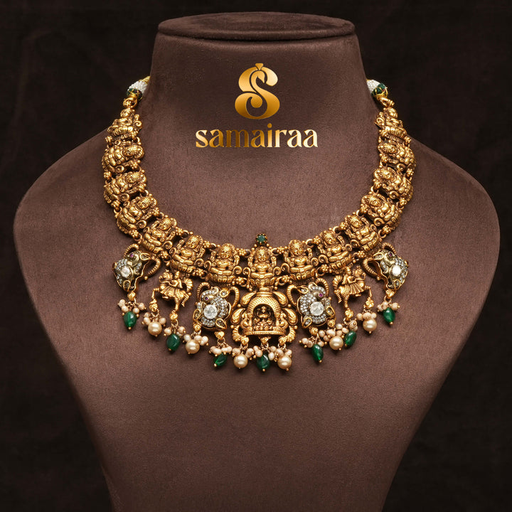 Traditional 92.5 silver temple necklace with Lakshmi motifs, emerald stone detailing, and intricate heritage craftsmanship by Sri Fine Jewellery Hyderabad (https://srifinejewellery.com)