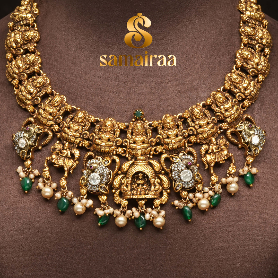 Traditional 92.5 silver temple necklace with Lakshmi motifs, emerald stone detailing, and intricate heritage craftsmanship by Sri Fine Jewellery Hyderabad (https://srifinejewellery.com)
