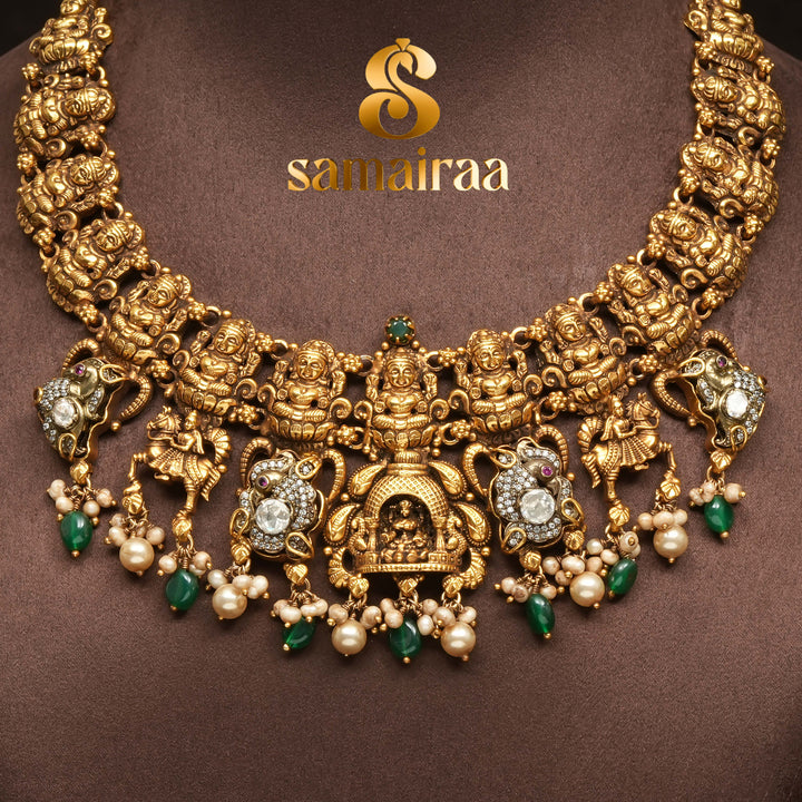Traditional 92.5 silver temple necklace with Lakshmi motifs, emerald stone detailing, and intricate heritage craftsmanship by Sri Fine Jewellery Hyderabad (https://srifinejewellery.com)