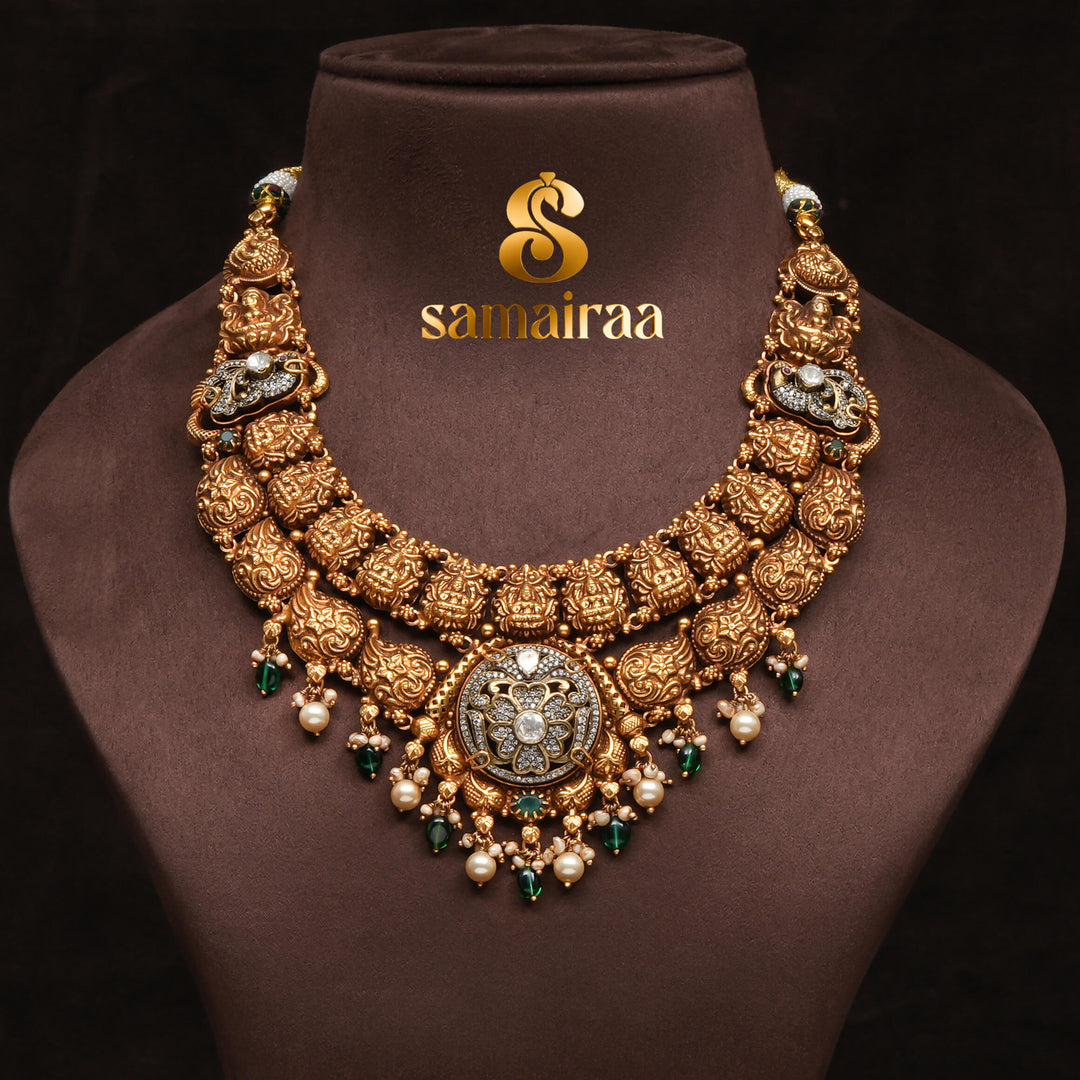 Traditional 92.5 silver temple necklace with Lakshmi pendant, mango motifs, emerald stone detailing, and intricate heritage craftsmanship by Sri Fine Jewellery Hyderabad (https://srifinejewellery.com)