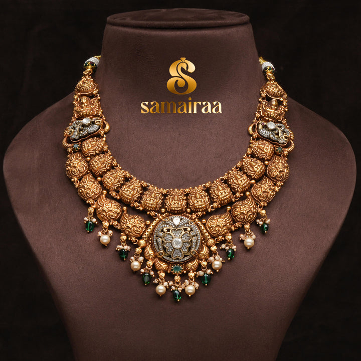 Traditional 92.5 silver temple necklace with Lakshmi pendant, mango motifs, emerald stone detailing, and intricate heritage craftsmanship by Sri Fine Jewellery Hyderabad (https://srifinejewellery.com)