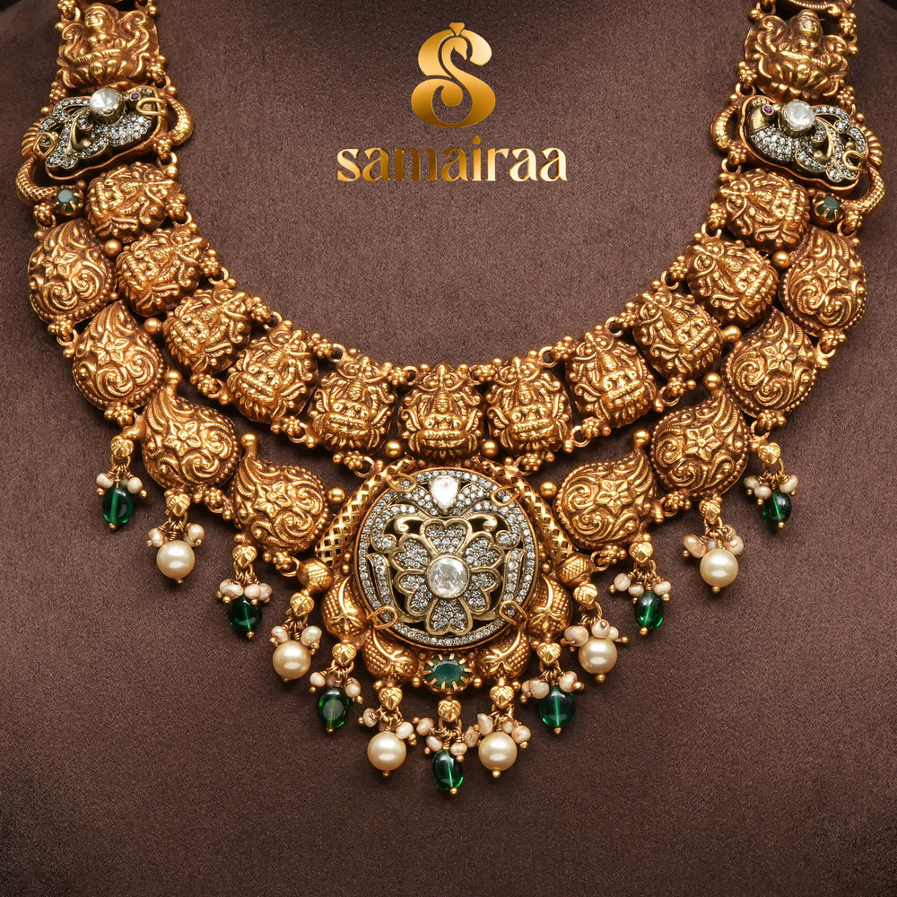 Traditional 92.5 silver temple necklace with Lakshmi pendant, mango motifs, emerald stone detailing, and intricate heritage craftsmanship by Sri Fine Jewellery Hyderabad (https://srifinejewellery.com)
