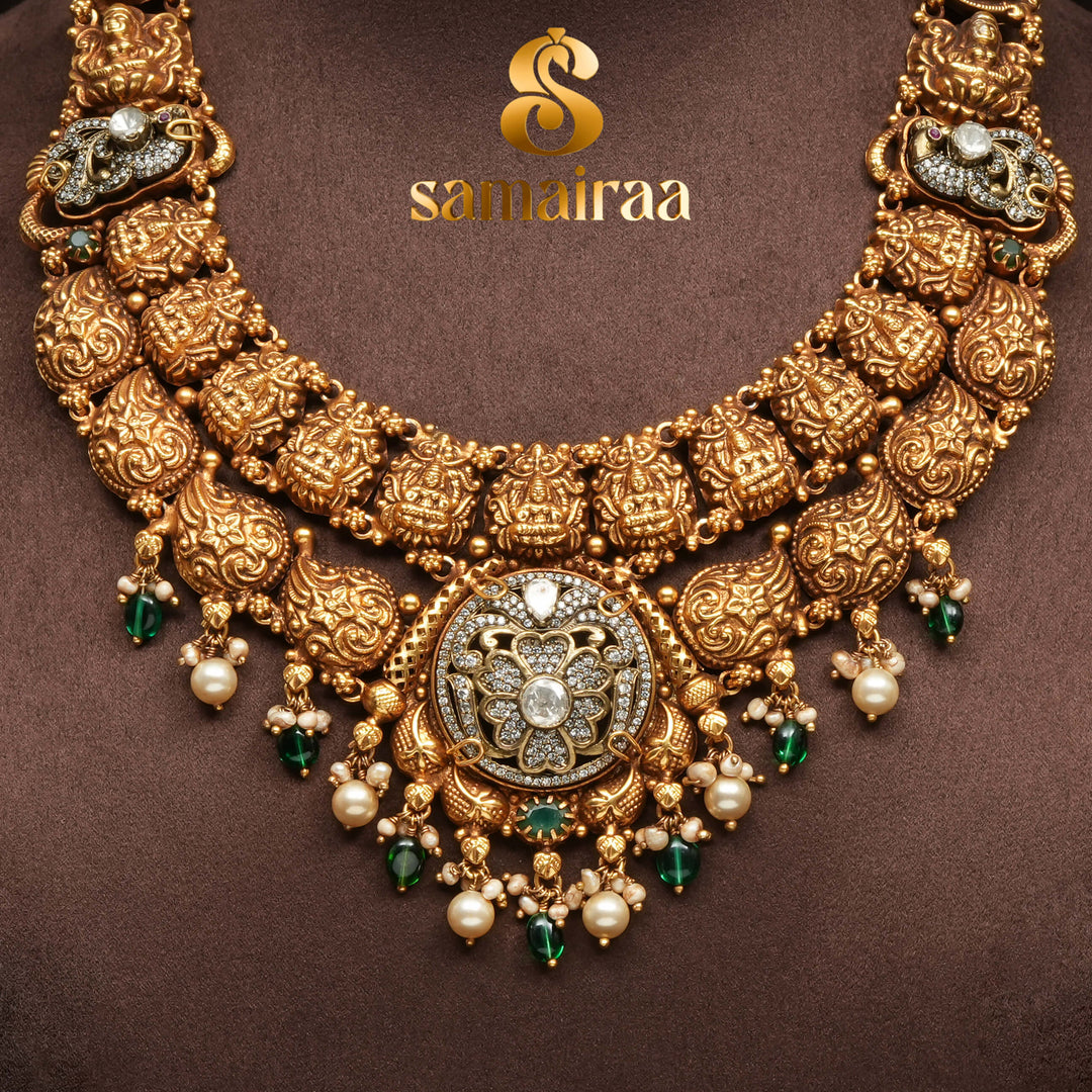 Traditional 92.5 silver temple necklace with Lakshmi pendant, mango motifs, emerald stone detailing, and intricate heritage craftsmanship by Sri Fine Jewellery Hyderabad (https://srifinejewellery.com)