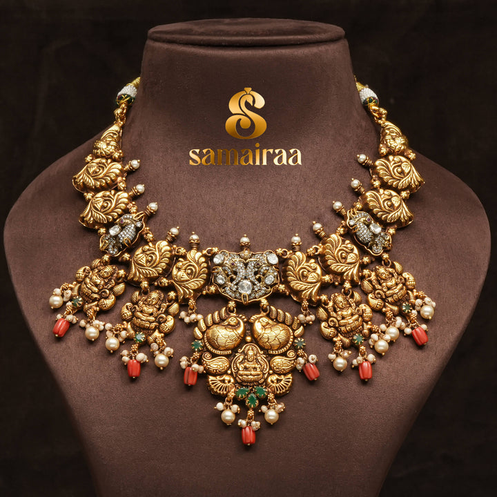 Traditional 92.5 silver temple necklace with Lakshmi pendant, peacock motifs, emerald stone detailing, and intricate heritage craftsmanship by Sri Fine Jewellery Hyderabad (https://srifinejewellery.com)
