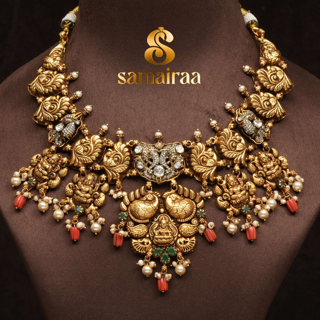 Traditional 92.5 silver temple necklace with Lakshmi pendant, peacock motifs, emerald stone detailing, and intricate heritage craftsmanship by Sri Fine Jewellery Hyderabad (https://srifinejewellery.com)