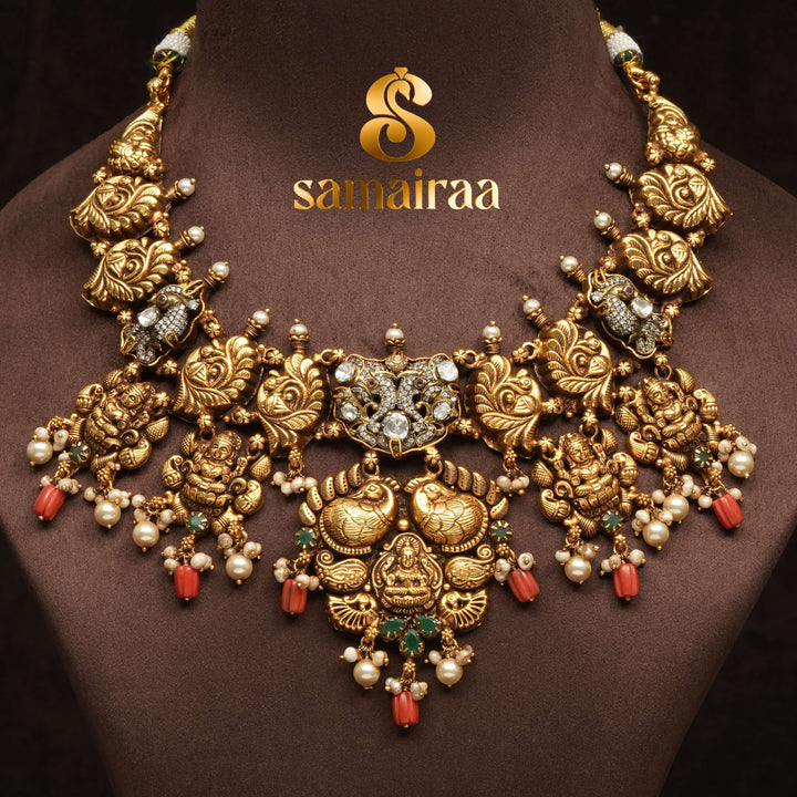 Traditional 92.5 silver temple necklace with Lakshmi pendant, peacock motifs, emerald stone detailing, and intricate heritage craftsmanship by Sri Fine Jewellery Hyderabad (https://srifinejewellery.com)