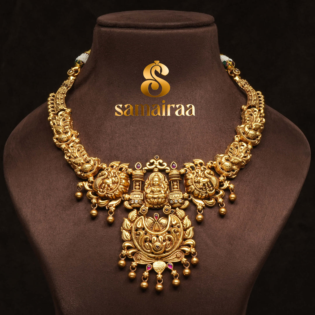 Traditional 92.5 silver temple necklace with Lakshmi pendant, peacock motifs, ruby stone detailing, and intricate heritage craftsmanship by Sri Fine Jewellery Hyderabad (https://srifinejewellery.com)
