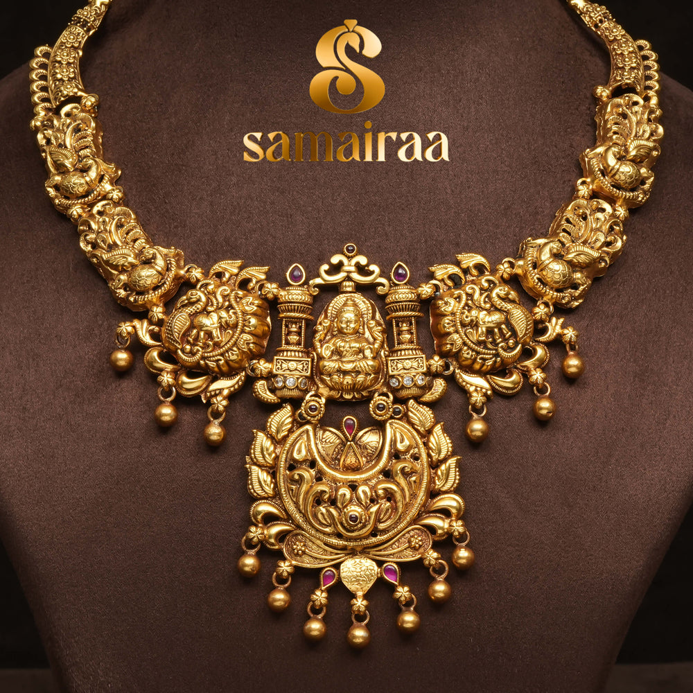 Traditional 92.5 silver temple necklace with Lakshmi pendant, peacock motifs, ruby stone detailing, and intricate heritage craftsmanship by Sri Fine Jewellery Hyderabad (https://srifinejewellery.com)