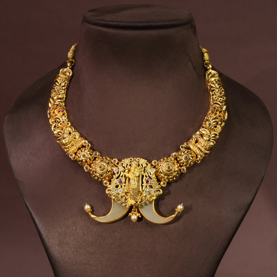 Antique temple necklace in 92.5 silver with Krishna pendant, handcrafted south indian bridal jewellery with premium gold finish and traditional heritage design by Sri Fine Jewellery Punjagutta Hyderabad.
