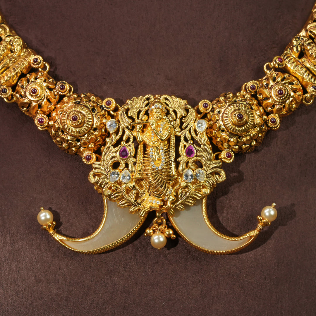 Antique temple necklace in 92.5 silver with Krishna pendant, handcrafted south indian bridal jewellery with premium gold finish and traditional heritage design by Sri Fine Jewellery Punjagutta Hyderabad.