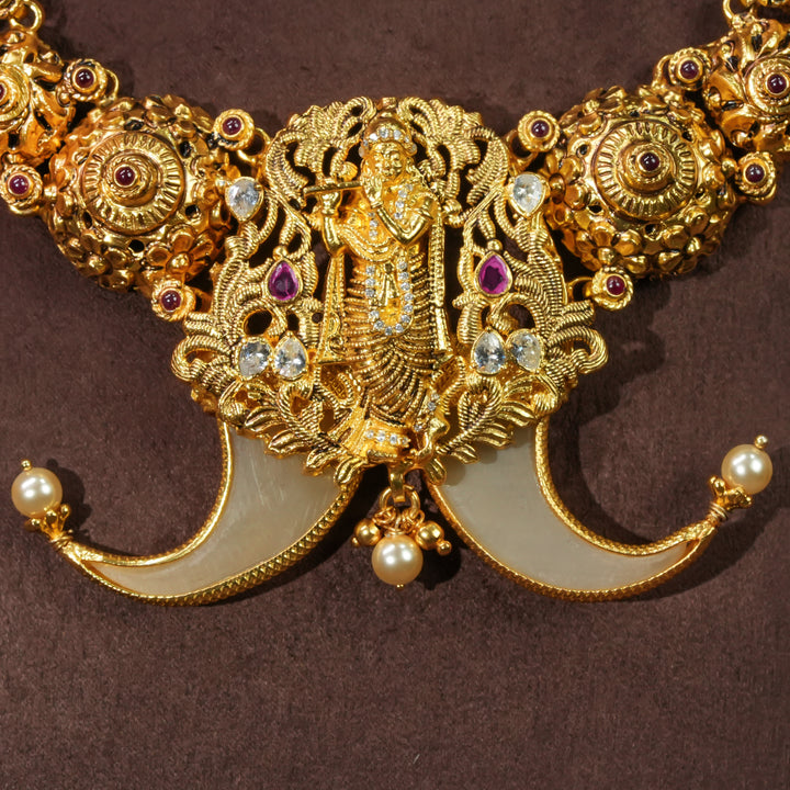 Close-up view of antique temple necklace in 92.5 silver with Krishna pendant, handcrafted south indian bridal jewellery with premium gold finish and traditional heritage design by Sri Fine Jewellery Punjagutta Hyderabad.