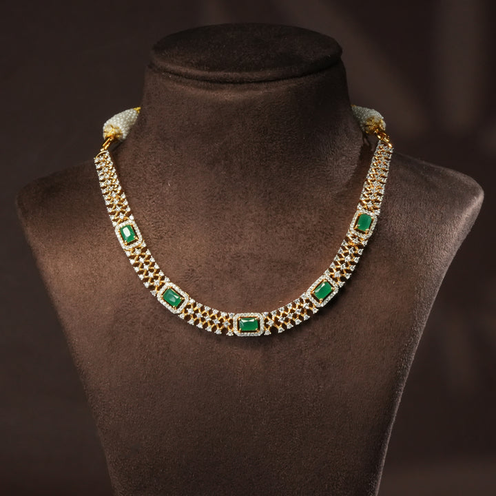 Luxury diamond-look silver cz emerald necklace with premium cz stones and semi-precious emerald stone in 92.5 silver, party wear jewellery with gold finish by Sri Fine Jewellery Punjagutta Hyderabad.