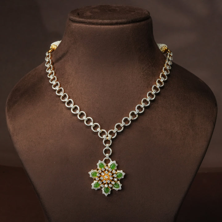 Luxury diamond-look silver cz emerald necklace with premium cz stones and semi-precious emerald stone in 92.5 silver, party wear jewellery with gold finish by Sri Fine Jewellery Punjagutta Hyderabad.