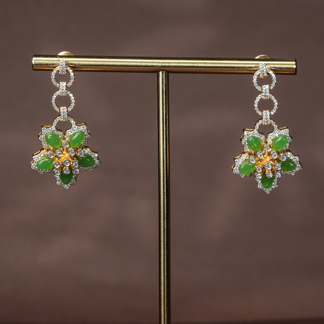Luxury diamond-look silver cz emerald earrings with premium cz stones and semi-precious emerald stone in 92.5 silver, party wear jewellery with gold finish by Sri Fine Jewellery Punjagutta Hyderabad.