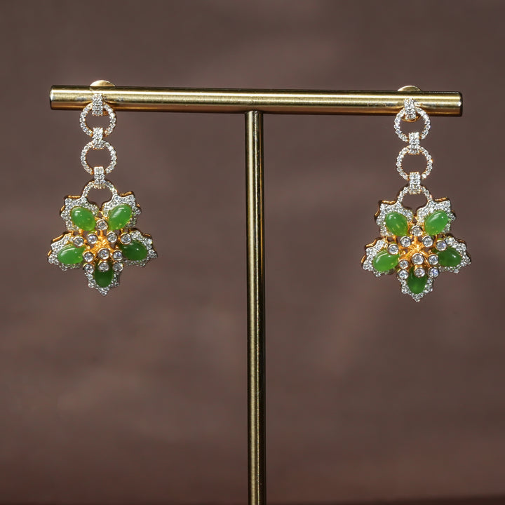 Luxury diamond-look silver cz emerald earrings with premium cz stones and semi-precious emerald stone in 92.5 silver, party wear jewellery with gold finish by Sri Fine Jewellery Punjagutta Hyderabad.