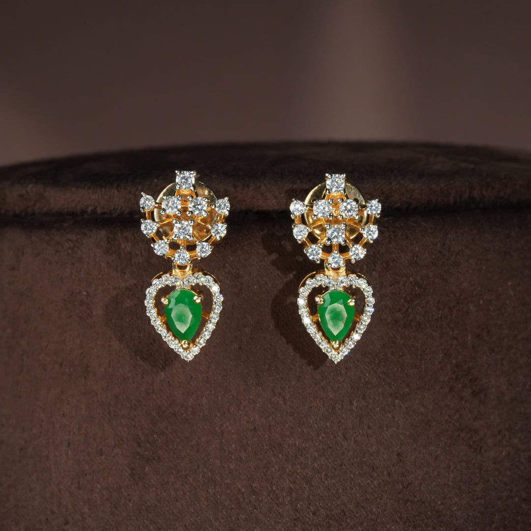 Luxury diamond-look silver cz emerald earrings with premium cz stones and semi-precious emerald stone in 92.5 silver, party wear jewellery with gold finish by Sri Fine Jewellery Punjagutta Hyderabad.