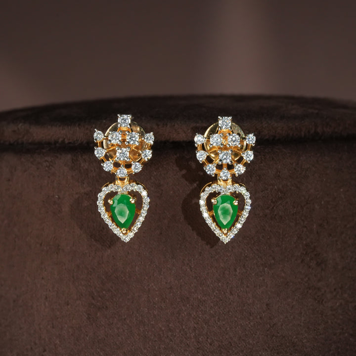 Luxury diamond-look silver cz emerald earrings with premium cz stones and semi-precious emerald stone in 92.5 silver, party wear jewellery with gold finish by Sri Fine Jewellery Punjagutta Hyderabad.