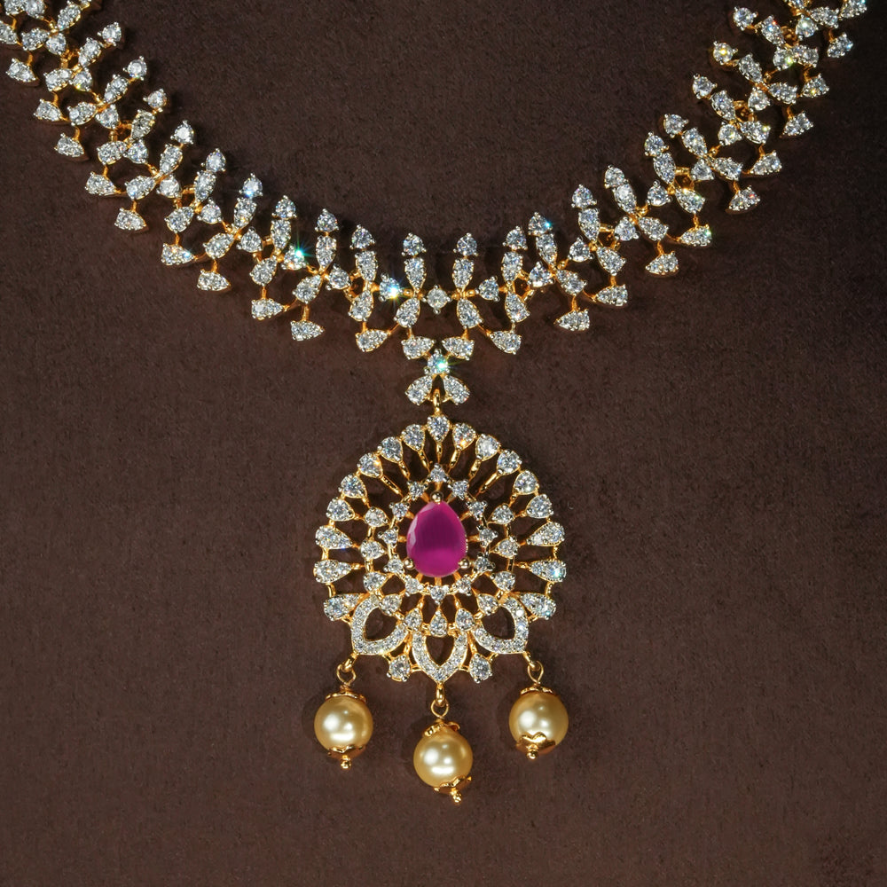 Close-up view of luxury diamond-look silver cz ruby necklace with premium cz stones and semi-precious ruby stone in 92.5 silver, bridal wedding jewellery with gold finish by Sri Fine Jewellery Punjagutta Hyderabad.