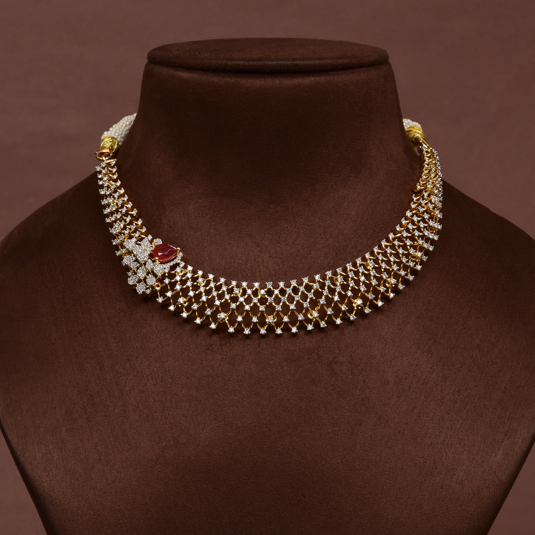 Luxury diamond-look silver cz ruby necklace with premium cz stones and semi-precious ruby stone in 92.5 silver, bridal wedding jewellery with gold finish by Sri Fine Jewellery Punjagutta Hyderabad.