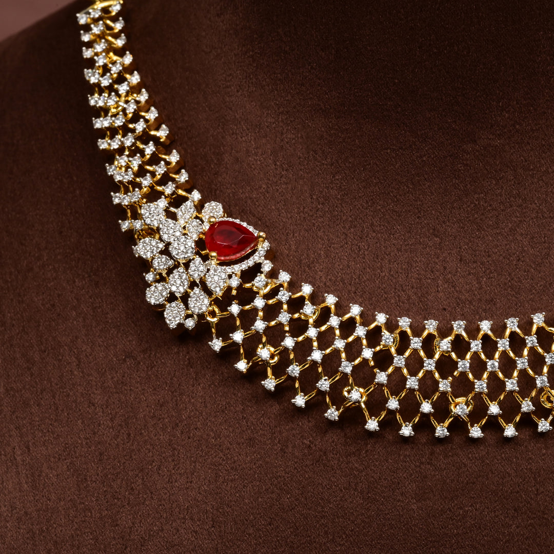 Side-view of luxury diamond-look silver cz ruby necklace with premium cz stones and semi-precious ruby stone in 92.5 silver, bridal wedding jewellery with gold finish by Sri Fine Jewellery Punjagutta Hyderabad.