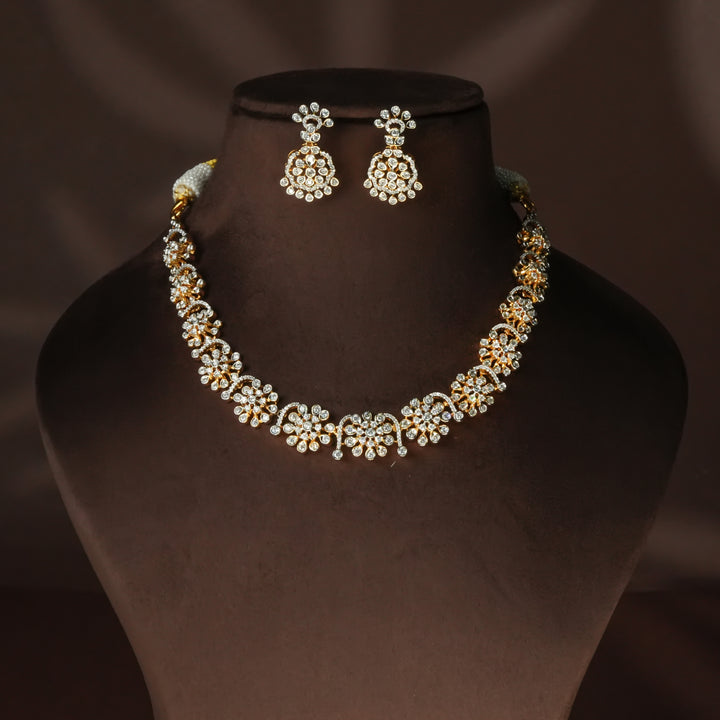Luxury diamond-look silver cz necklace set with premium cz stones in 92.5 silver, bridal wedding jewellery with gold finish by Sri Fine Jewellery Punjagutta Hyderabad.