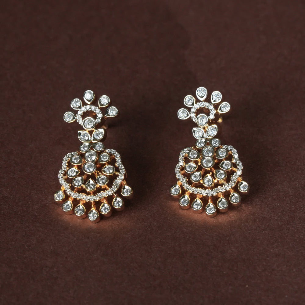 Luxury diamond-look silver cz earrings with premium cz stones in 92.5 silver, bridal wedding jewellery with gold finish by Sri Fine Jewellery Punjagutta Hyderabad.