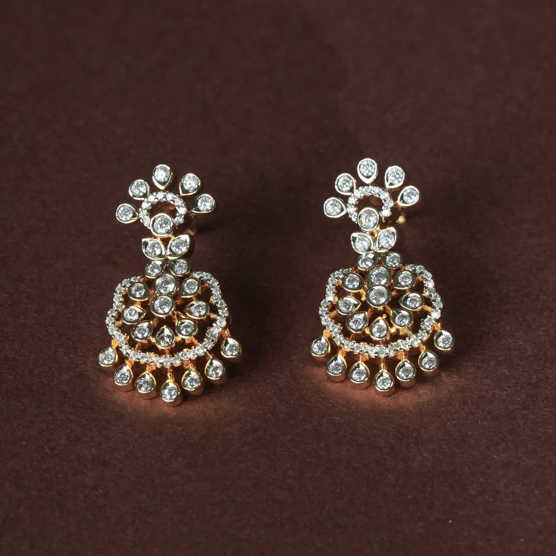 Luxury diamond-look silver cz earrings with premium cz stones in 92.5 silver, bridal wedding jewellery with gold finish by Sri Fine Jewellery Punjagutta Hyderabad.