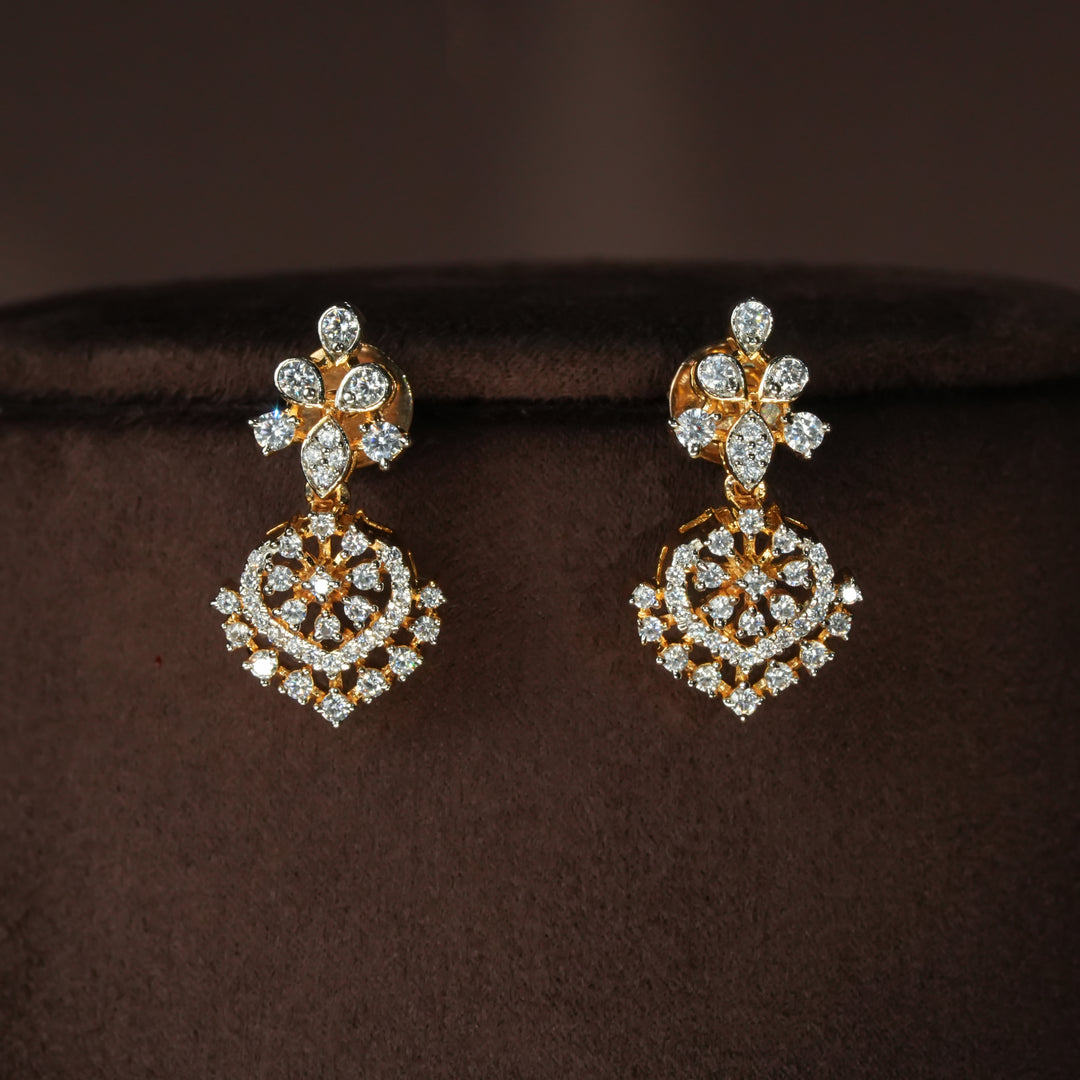 Luxury diamond-look silver earrings with premium cz stones in 92.5 silver, bridal wedding jewellery with gold finish by Sri Fine Jewellery Punjagutta Hyderabad.