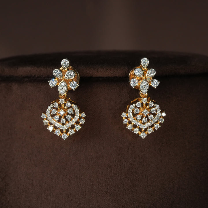 Luxury diamond-look silver earrings with premium cz stones in 92.5 silver, bridal wedding jewellery with gold finish by Sri Fine Jewellery Punjagutta Hyderabad.