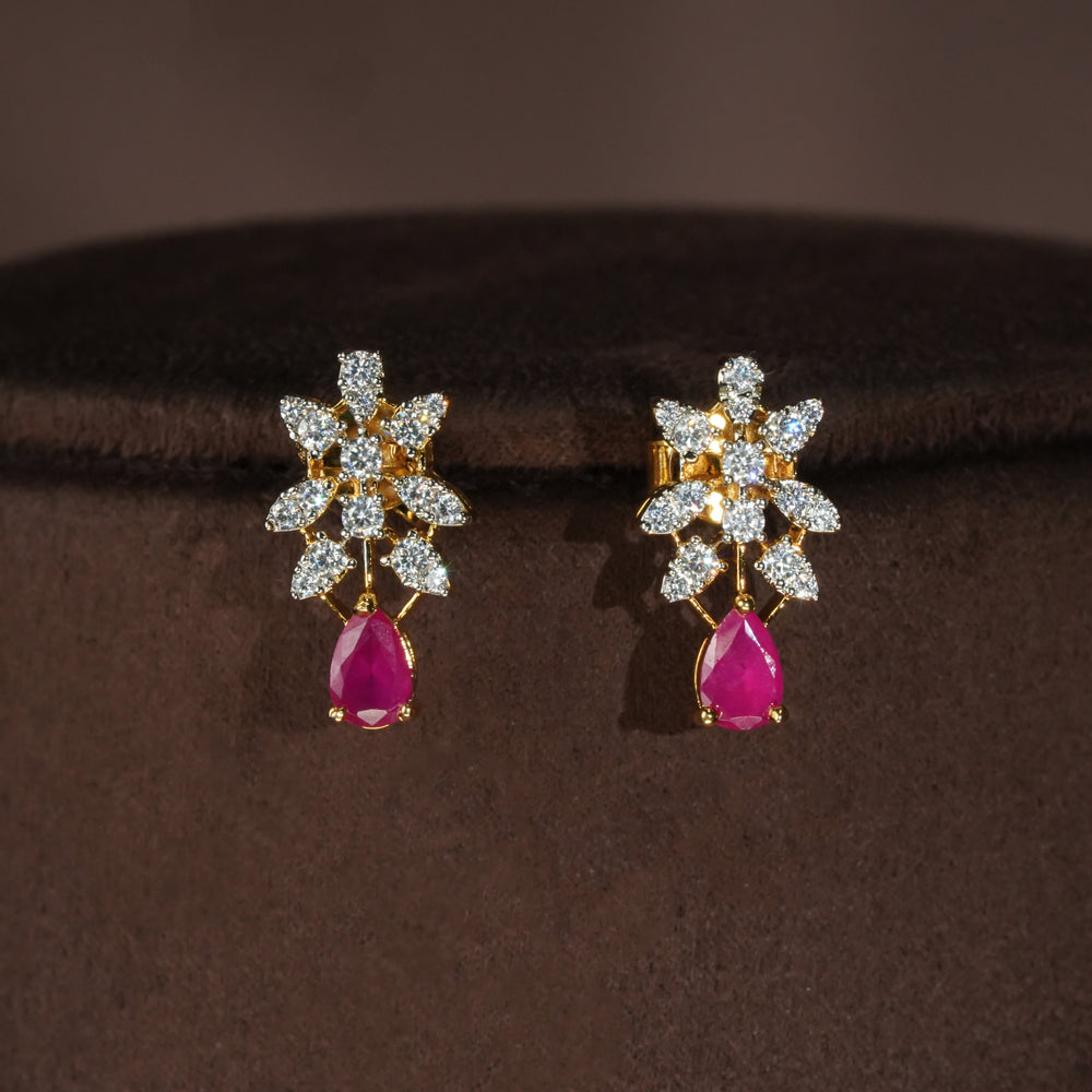 Luxury diamond-look silver earrings with premium cz stones and semi-precious ruby stones in 92.5 silver, bridal wedding jewellery with gold finish by Sri Fine Jewellery Punjagutta Hyderabad.