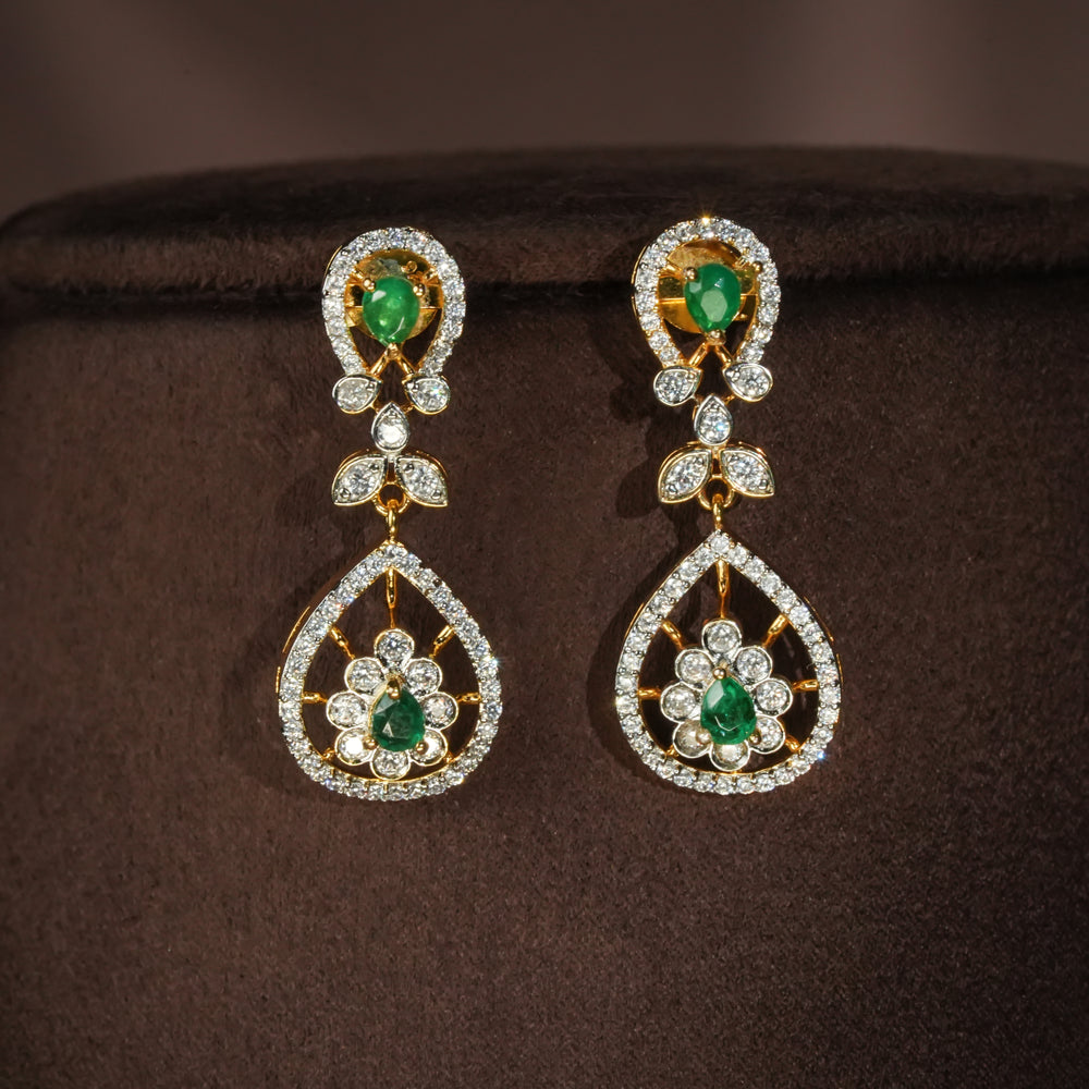 Luxury diamond-look silver earrings with premium cz stones and semi-precious emerald stones in 92.5 silver, bridal wedding jewellery with gold finish by Sri Fine Jewellery Punjagutta Hyderabad.
