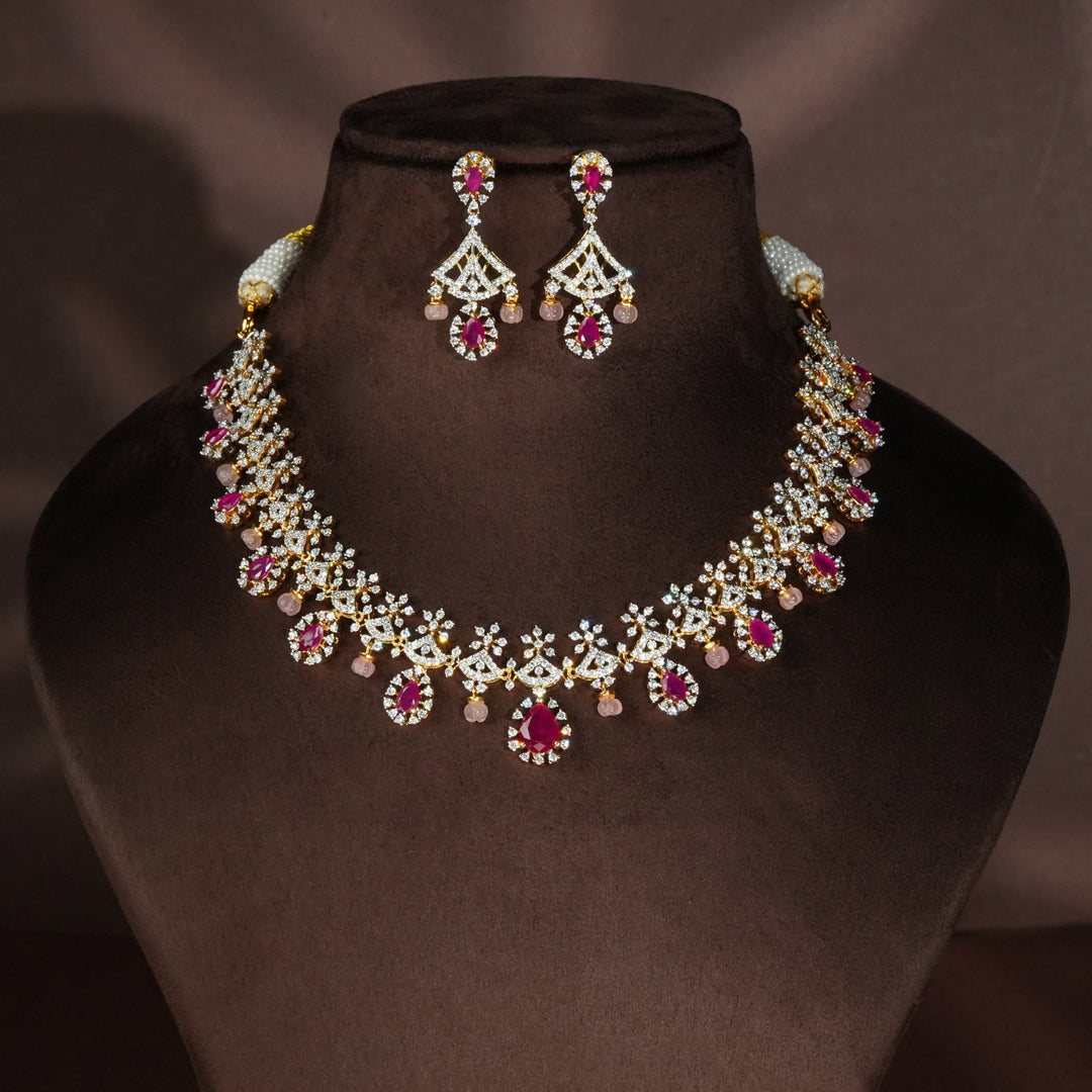 Luxury diamond-look silver necklace with premium cz stones and semi-precious ruby stones in 92.5 silver, bridal wedding jewellery with gold finish by Sri Fine Jewellery Punjagutta Hyderabad.