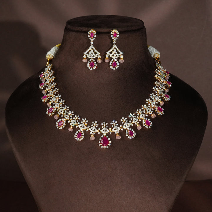 Luxury diamond-look silver necklace with premium cz stones and semi-precious ruby stones in 92.5 silver, bridal wedding jewellery with gold finish by Sri Fine Jewellery Punjagutta Hyderabad.
